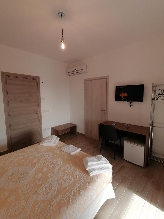 Postel nebo postele na pokoji v ubytování CLASS ROOMS AFFITTACAMERE