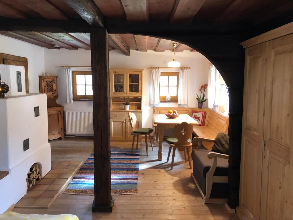 a kitchen and dining room with a table and chairs at Chalet Ramsau 8 in Bad Goisern