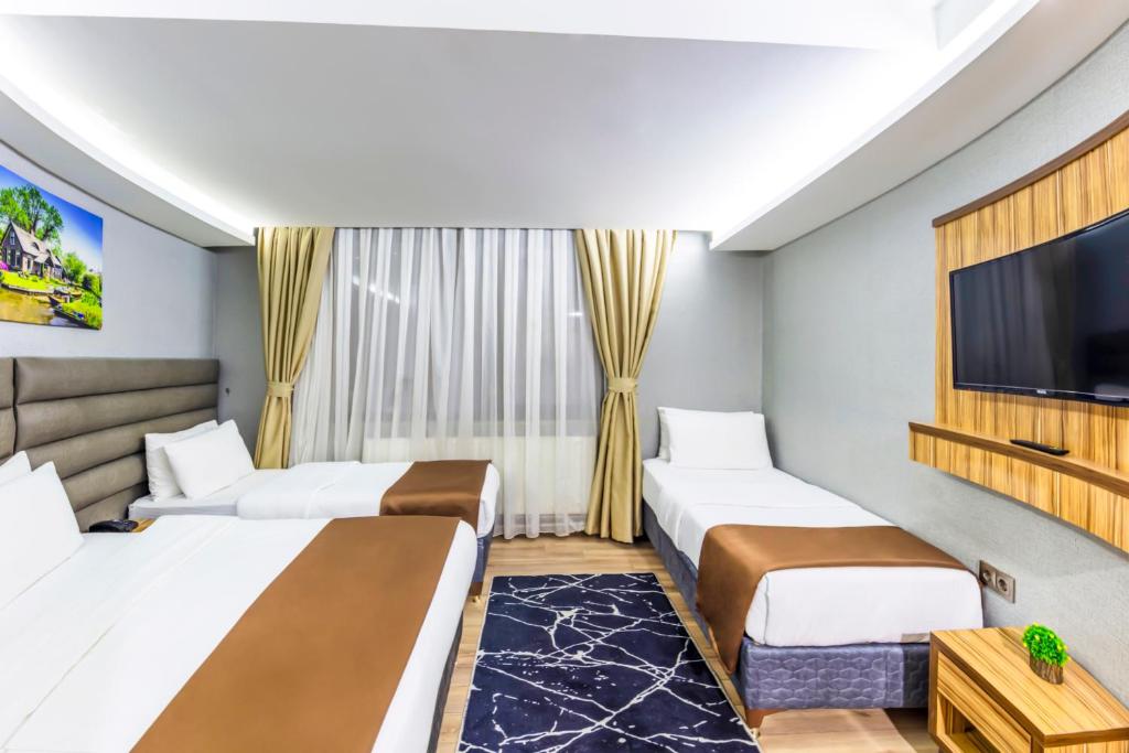 Postel nebo postele na pokoji v ubytování Dem İstanbul Airport Hotel
