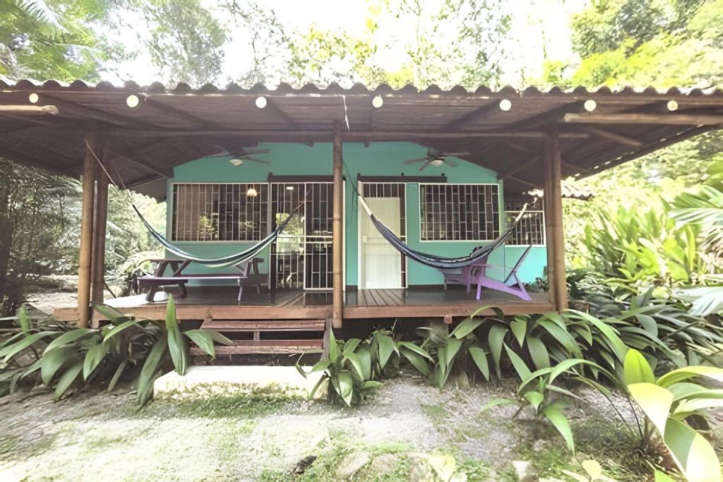 a gazebo with two hammocks on it at Jungle Dreamz in Manzanillo