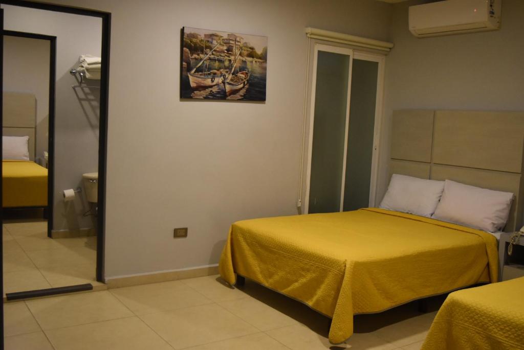 Postel nebo postele na pokoji v ubytování Hotel Boutique Boca - Veracruz