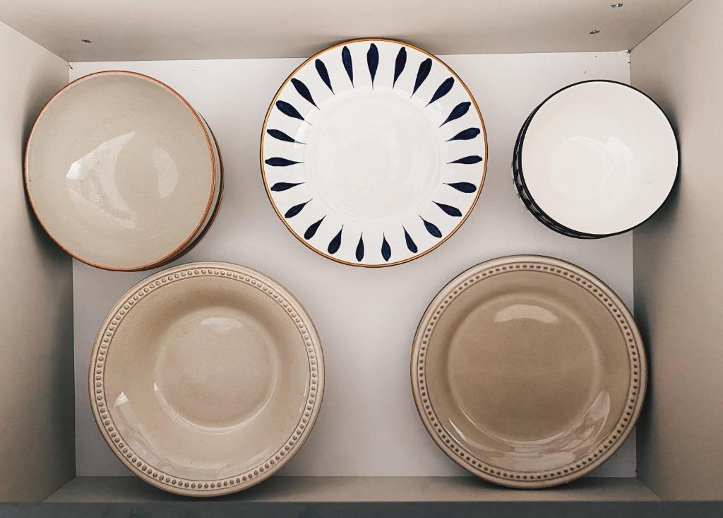 a group of plates hanging on a wall at Brand new, luxury beach flat in Tsarevo