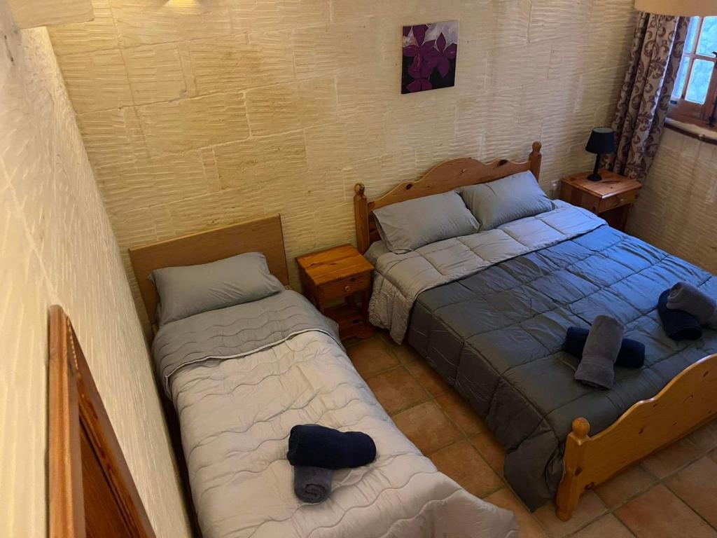Postel nebo postele na pokoji v ubytování Farmhouse with Pool, Tas-Summiena Gozo