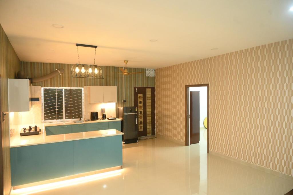 Kuchyň nebo kuchyňský kout v ubytování Mandolin Homestay in Dibrugarh - 2BHK Apartment