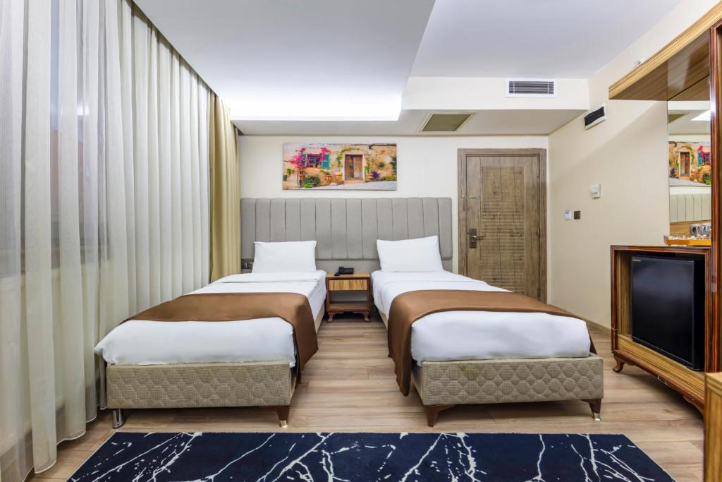 Postel nebo postele na pokoji v ubytování Dem İstanbul Airport Hotel