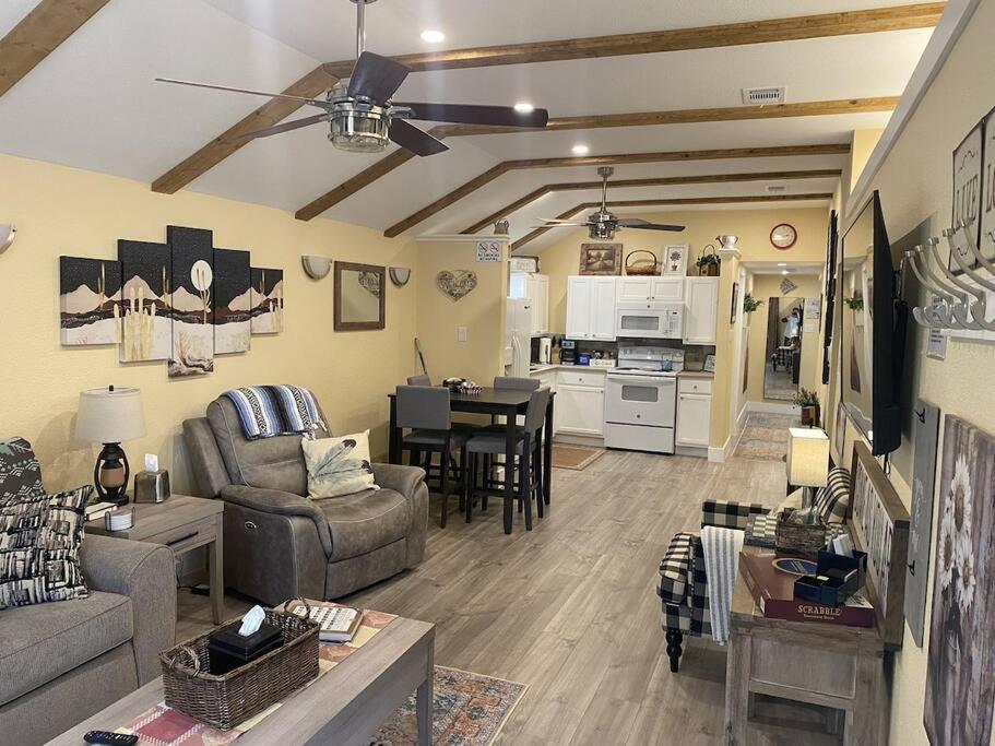 a living room with a couch and a table at Stockyards Cowtown Outpost-Less than 4 minutes to StockYards-Sleeps 8 in Fort Worth