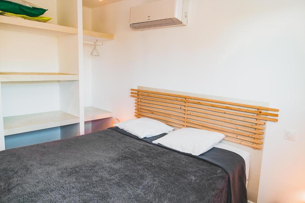 Postel nebo postele na pokoji v ubytování Résidence Villa Branda
