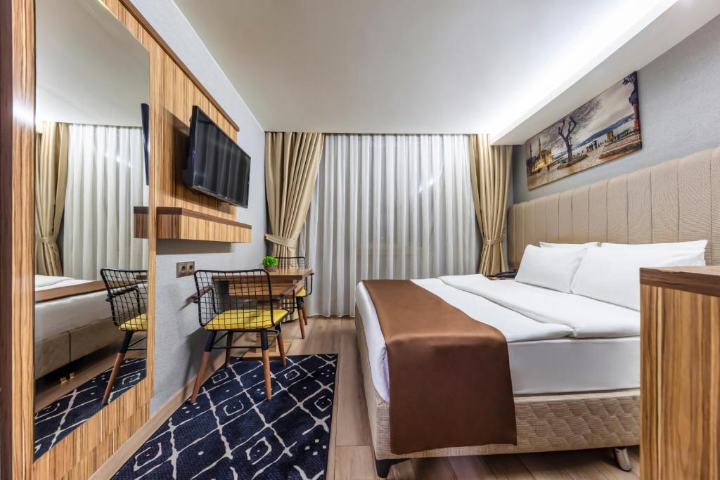 TV a/nebo společenská místnost v ubytování Dem İstanbul Airport Hotel