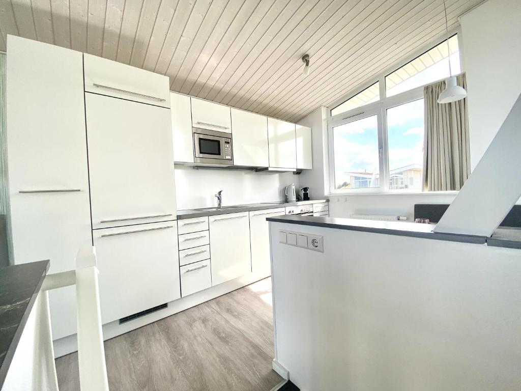 Køkken eller tekøkken på Ferienhaus Kleine Auszeit Marina Wendtorf