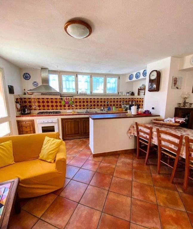 a kitchen with a couch and a table in a room at SOLEMARE in Palau