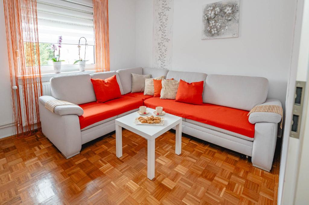 a living room with a couch and a table at Apartma Golob in Maribor