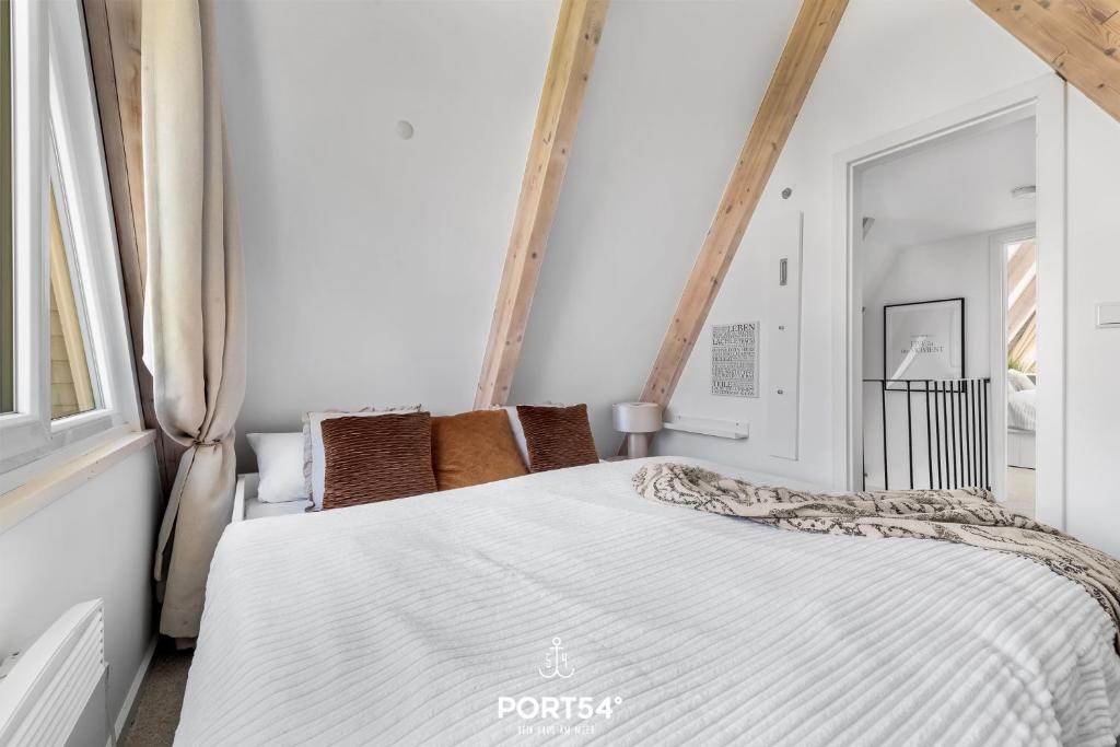 Postel nebo postele na pokoji v ubytování Lounge am Meer
