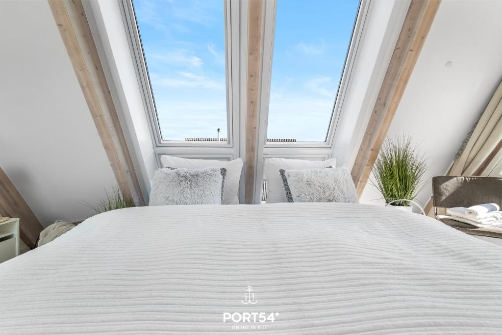 Postel nebo postele na pokoji v ubytování Lounge am Meer