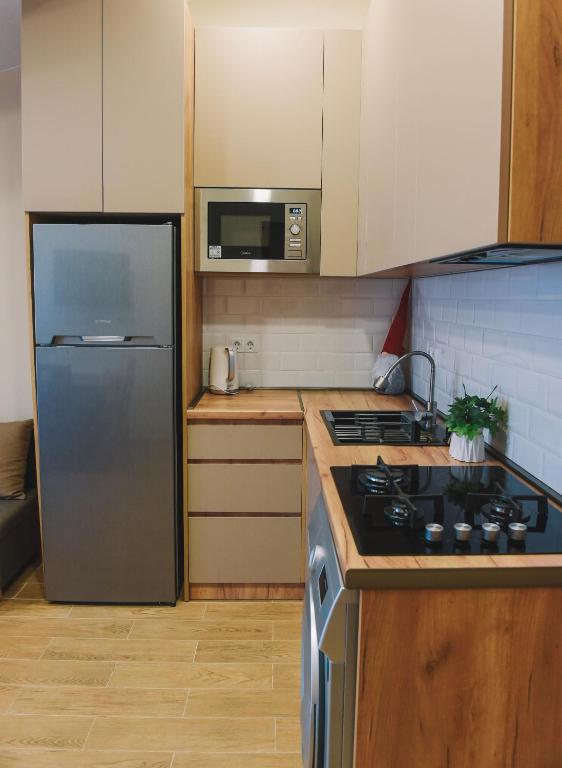 Кухня или мини-кухня в MaRKoS flat in Bakuriani Inn
