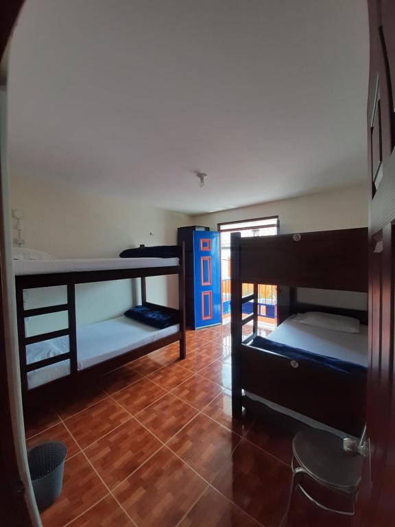 Postel nebo postele na pokoji v ubytování Km0 Hostel