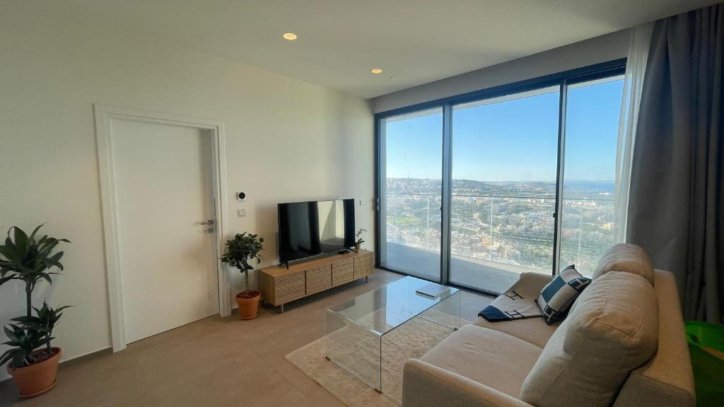 TV a/nebo společenská místnost v ubytování Mercury Tower Suites