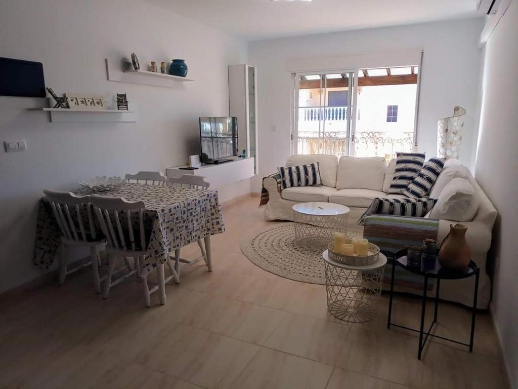 a living room with a couch and a table at Vista la Mar in Villaricos