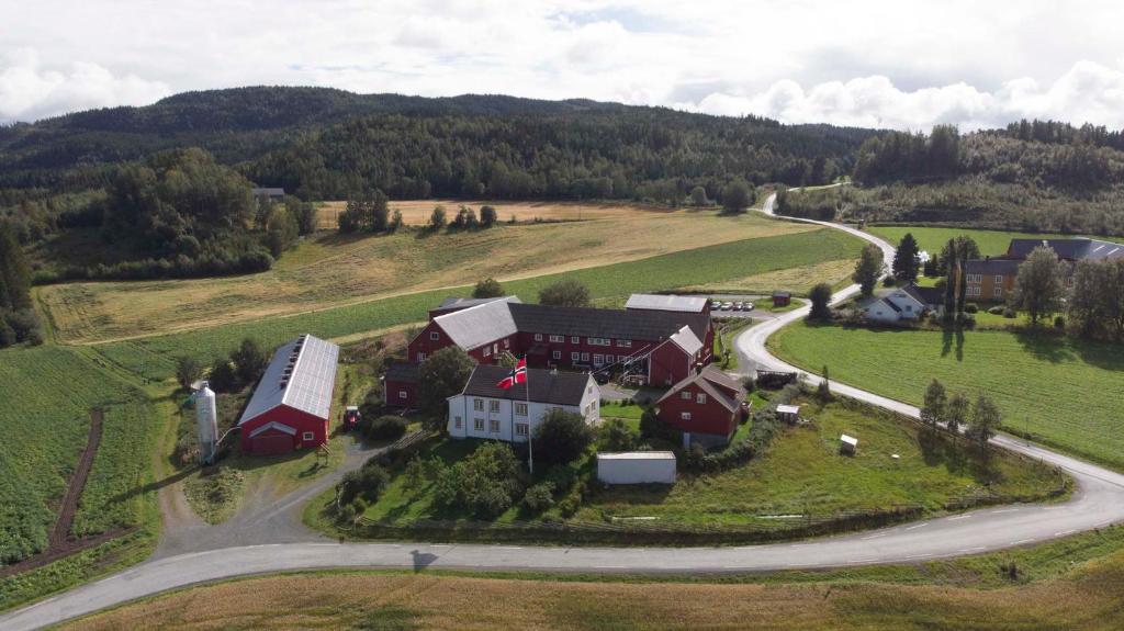 an aerial view of a large house on a hill at Munkeby Herberge in Levanger