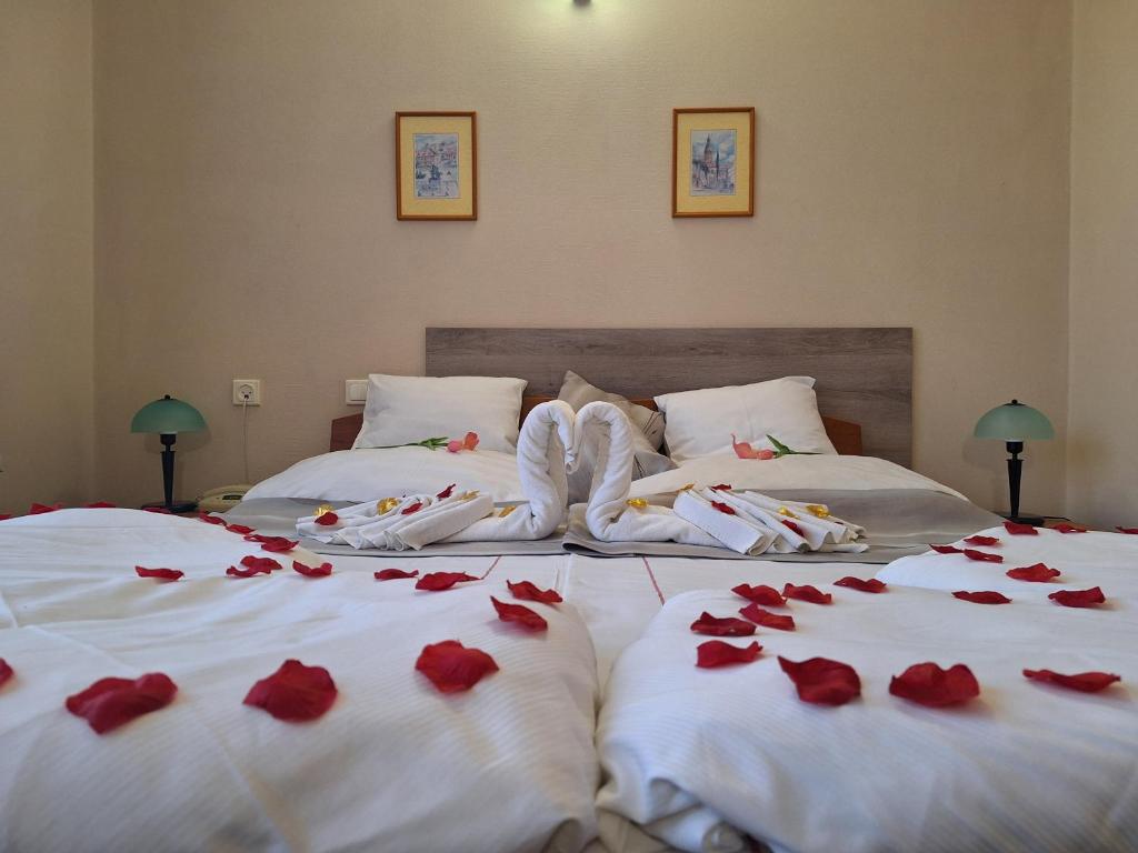 Postel nebo postele na pokoji v ubytování Hotel Unicornis