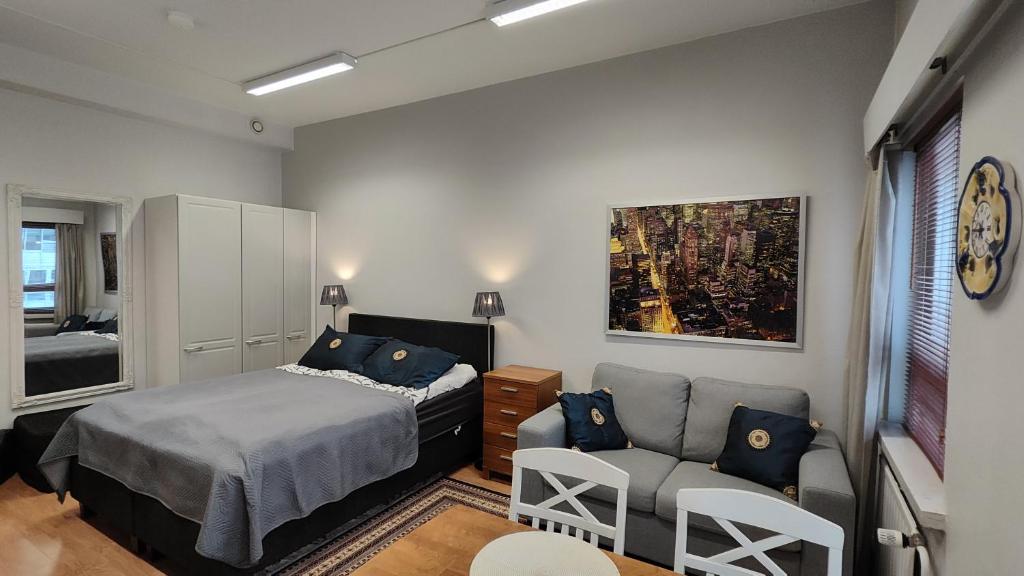 Postel nebo postele na pokoji v ubytování City Apartment Kuopio