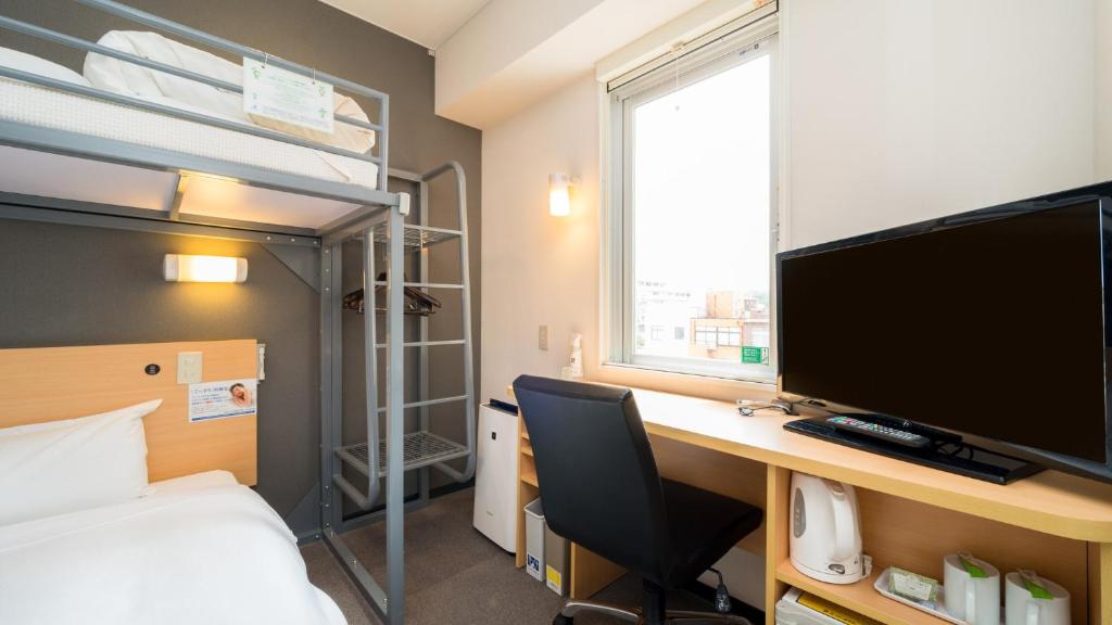 Postel nebo postele na pokoji v ubytování Super Hotel Yonago Ekimae