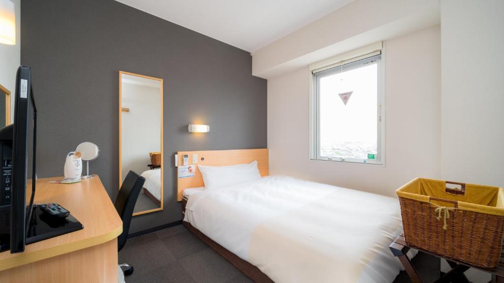 Postel nebo postele na pokoji v ubytování Super Hotel Yonago Ekimae