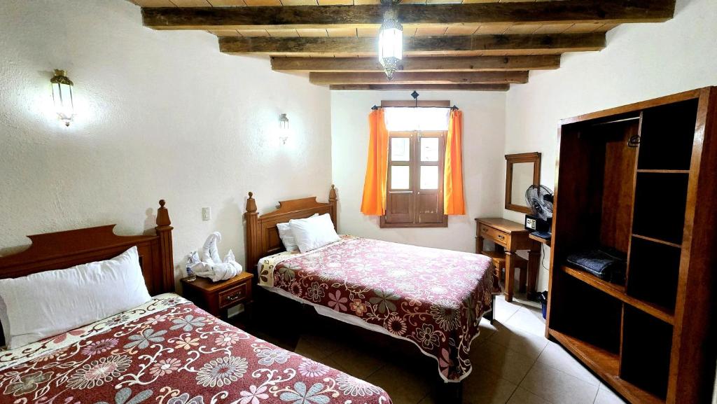 Postel nebo postele na pokoji v ubytování Hotel Plaza Baratillo