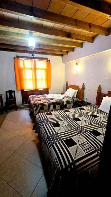 Postel nebo postele na pokoji v ubytování Hotel Plaza Baratillo