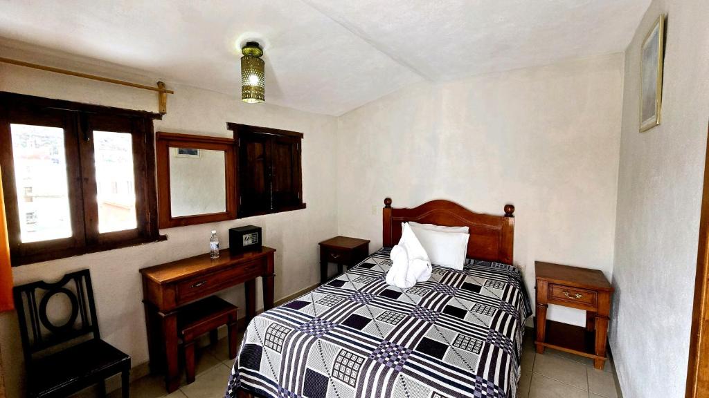 Postel nebo postele na pokoji v ubytování Hotel Plaza Baratillo