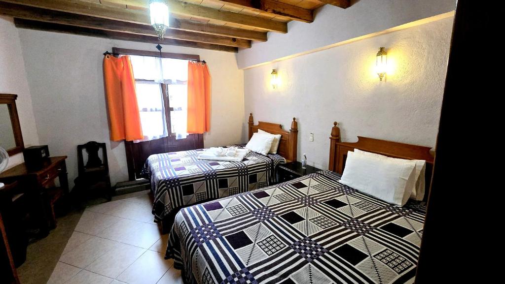 Postel nebo postele na pokoji v ubytování Hotel Plaza Baratillo