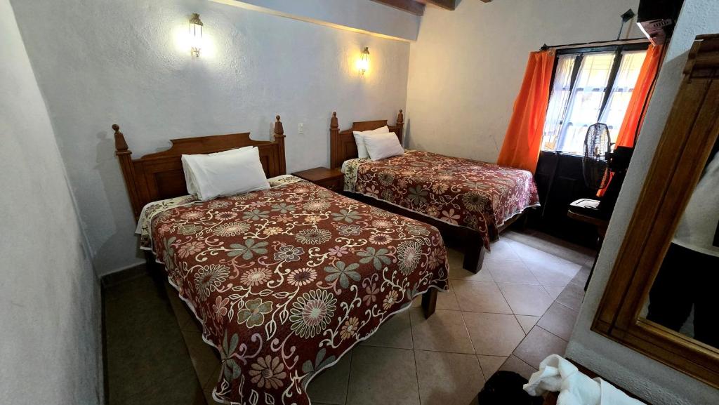 Postel nebo postele na pokoji v ubytování Hotel Plaza Baratillo