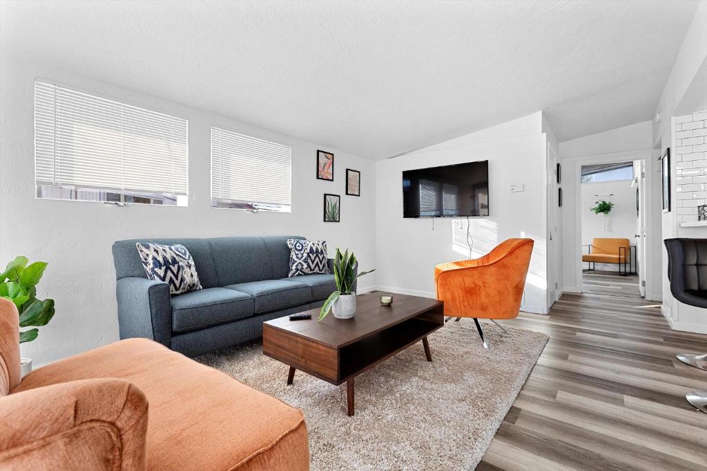 a living room with a couch and a table at Bright & Stylish 2 Bedroom Home in Missoula