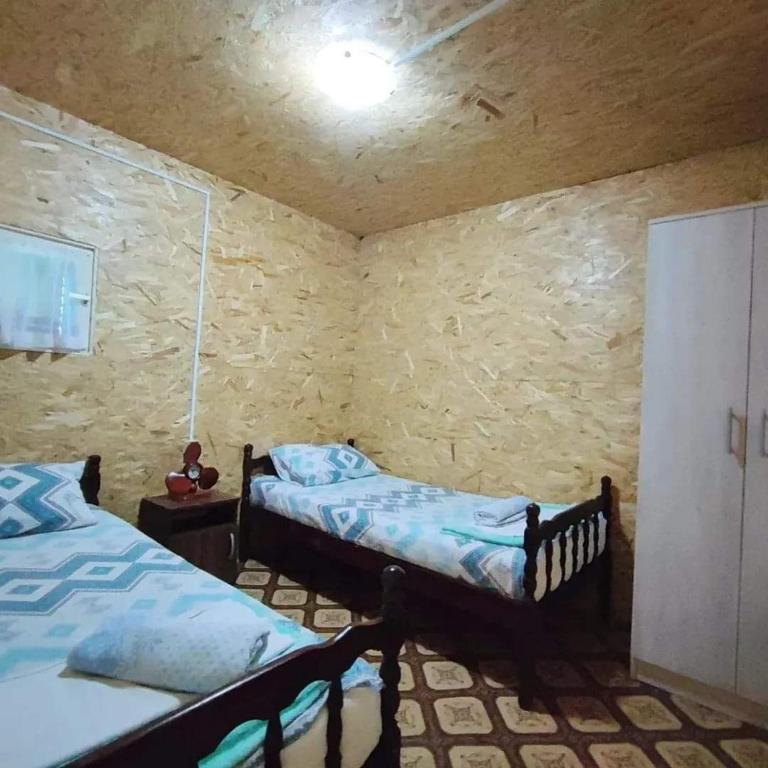 Postel nebo postele na pokoji v ubytování Kucica Truma