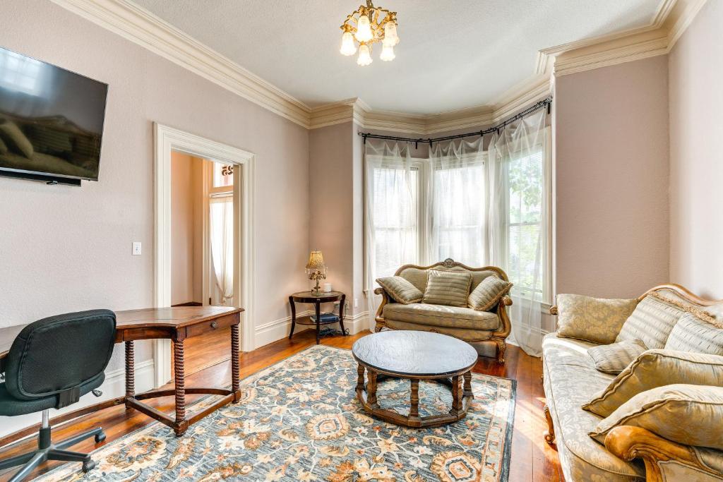 a living room with a couch and a table at Stylish Sacramento Retreat Less Than 1 Mi to Downtown! in Sacramento