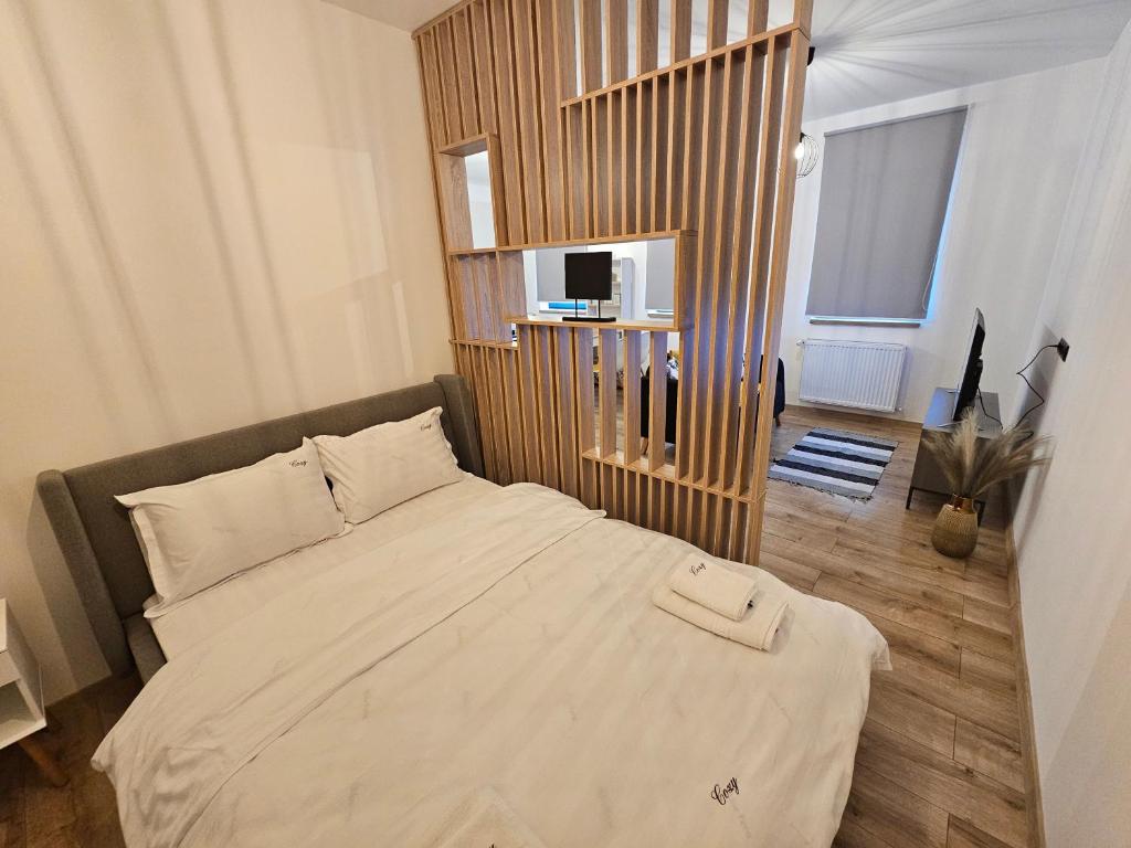 מיטה או מיטות בחדר ב-Cozy Central Studios - Targu Mures