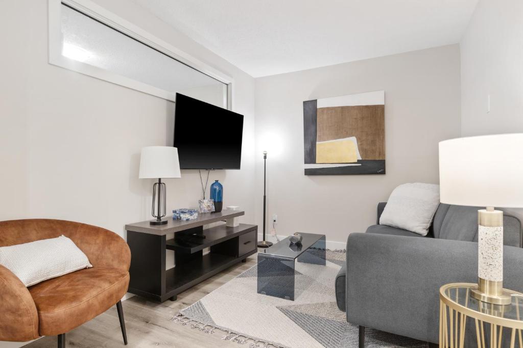 a living room with a couch and a tv at 14 minutes from downtown, brand new home in Ottawa in Ottawa