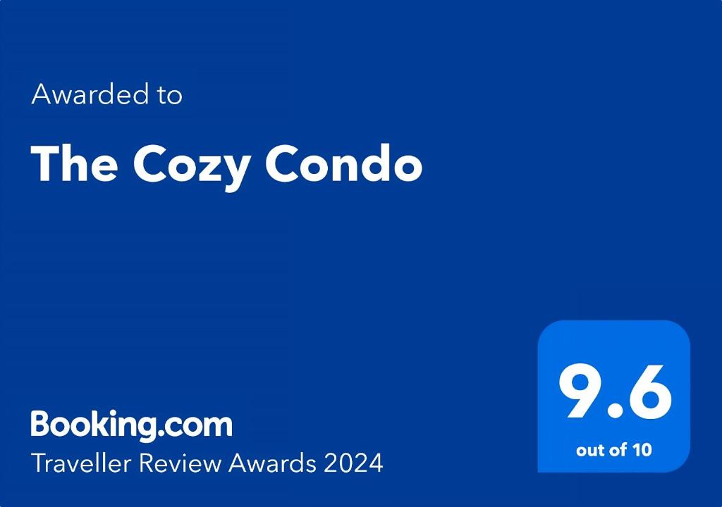 a blue box with the text upgraded to the cozy combo at The Cozy Condo in Arouca