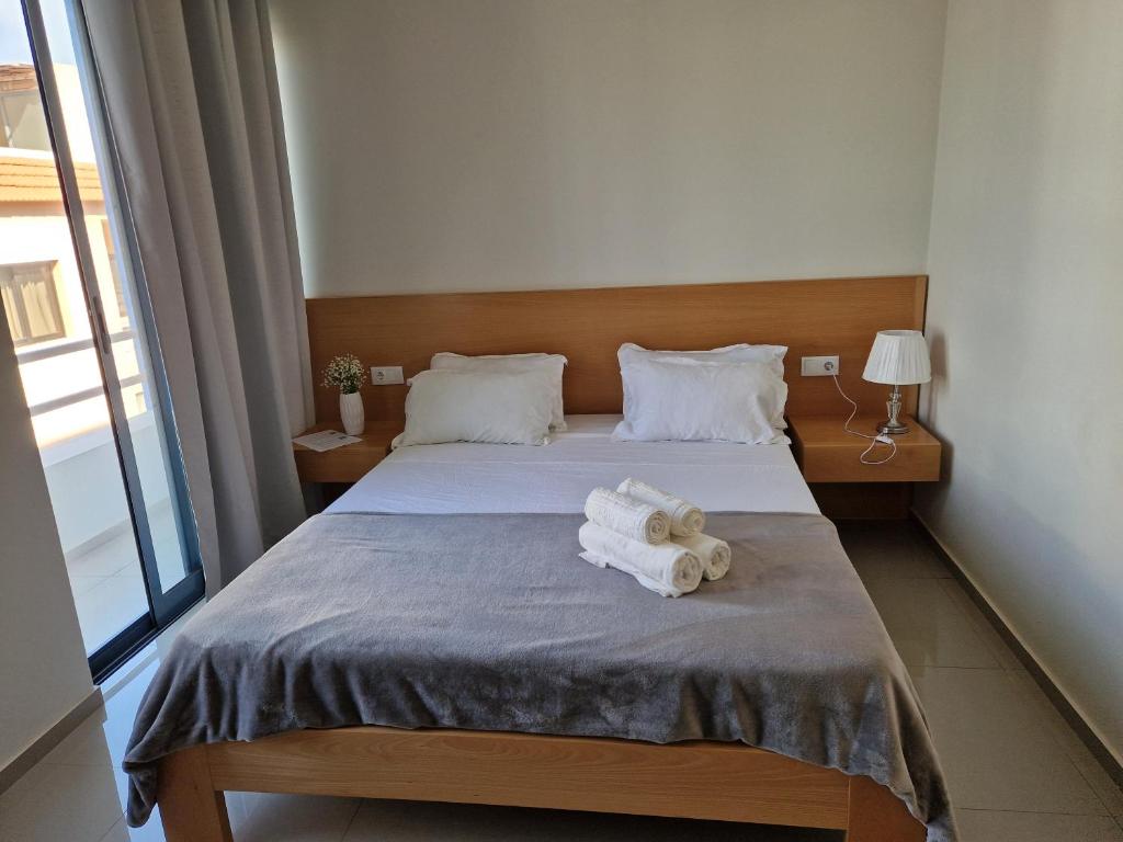 Ένα ή περισσότερα κρεβάτια σε δωμάτιο στο Apartamentos Beira-Mar