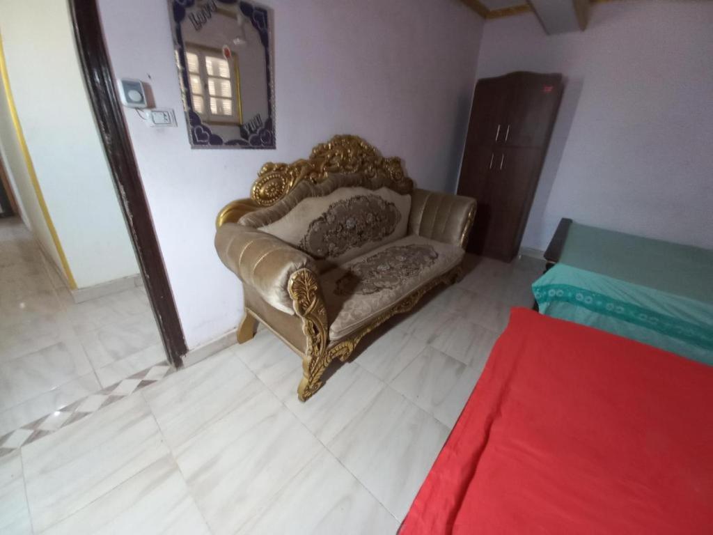A bed or beds in a room at Pyramids Hotel