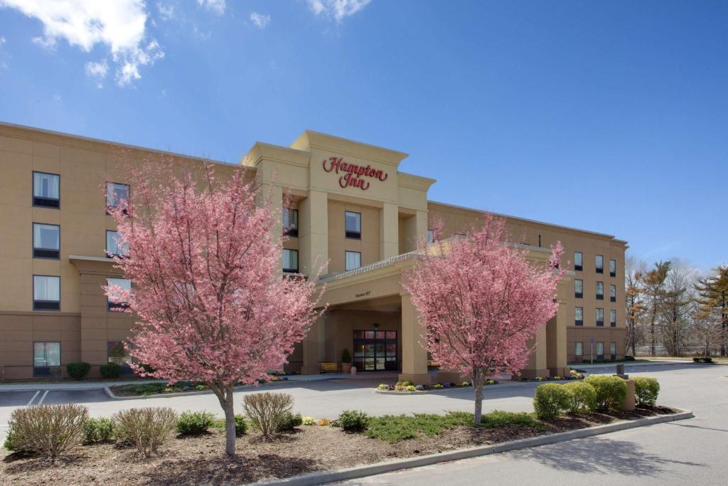 a rendering of the front of a hospital with two trees at Hampton Inn by Hilton Garden City Long Island in Garden City