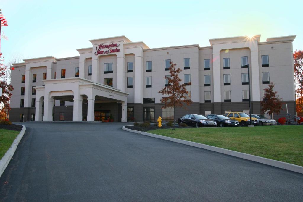 a large white building with cars parked in front of it at Hampton Inn and Suites Jamestown in Jamestown
