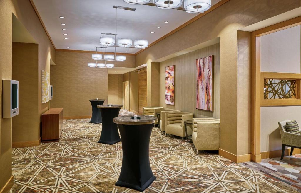 a lobby with stools and a waiting room at DoubleTree by Hilton Houston Intercontinental Airport in Houston