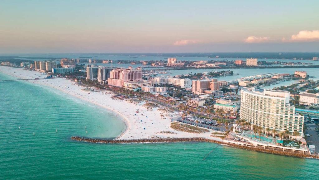 an aerial view of a beach with buildings and the ocean at The Avalon in Clearwater