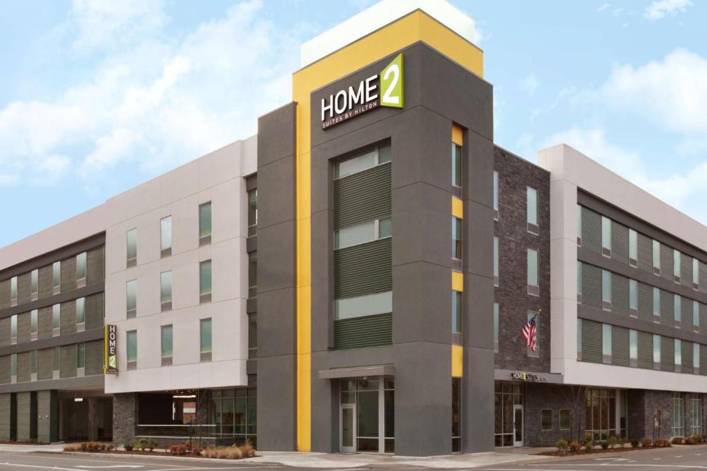 an office building with a hane sign on it at Home2 Suites by Hilton Eugene Downtown University Area in Eugene