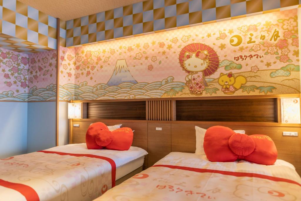 Postel nebo postele na pokoji v ubytování Ryugujo Spa Hotel Mikazuki Fujimitei