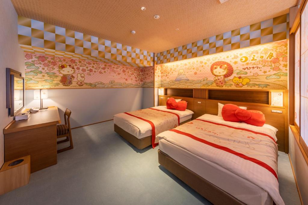 Postel nebo postele na pokoji v ubytování Ryugujo Spa Hotel Mikazuki Fujimitei
