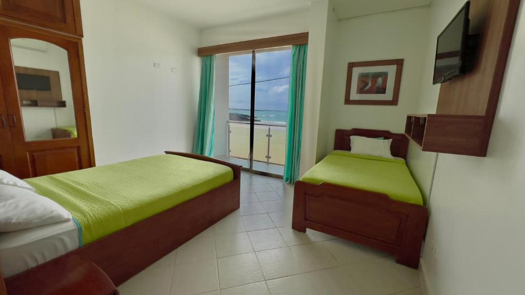 Postel nebo postele na pokoji v ubytování Hotel Sierra Negra