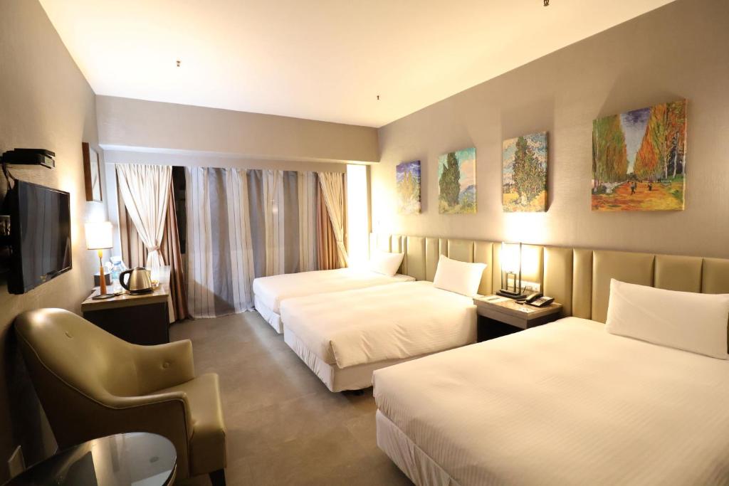 Postel nebo postele na pokoji v ubytování Kaohsiung Ahotel