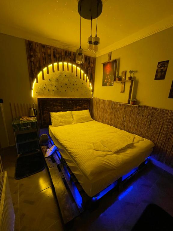 a bedroom with a bed with lights on it at Yeniköy KONSEPT HOTEL in Arnavutköy