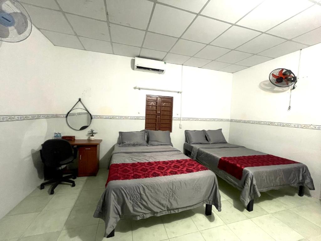 Postel nebo postele na pokoji v ubytování Motel An Bình
